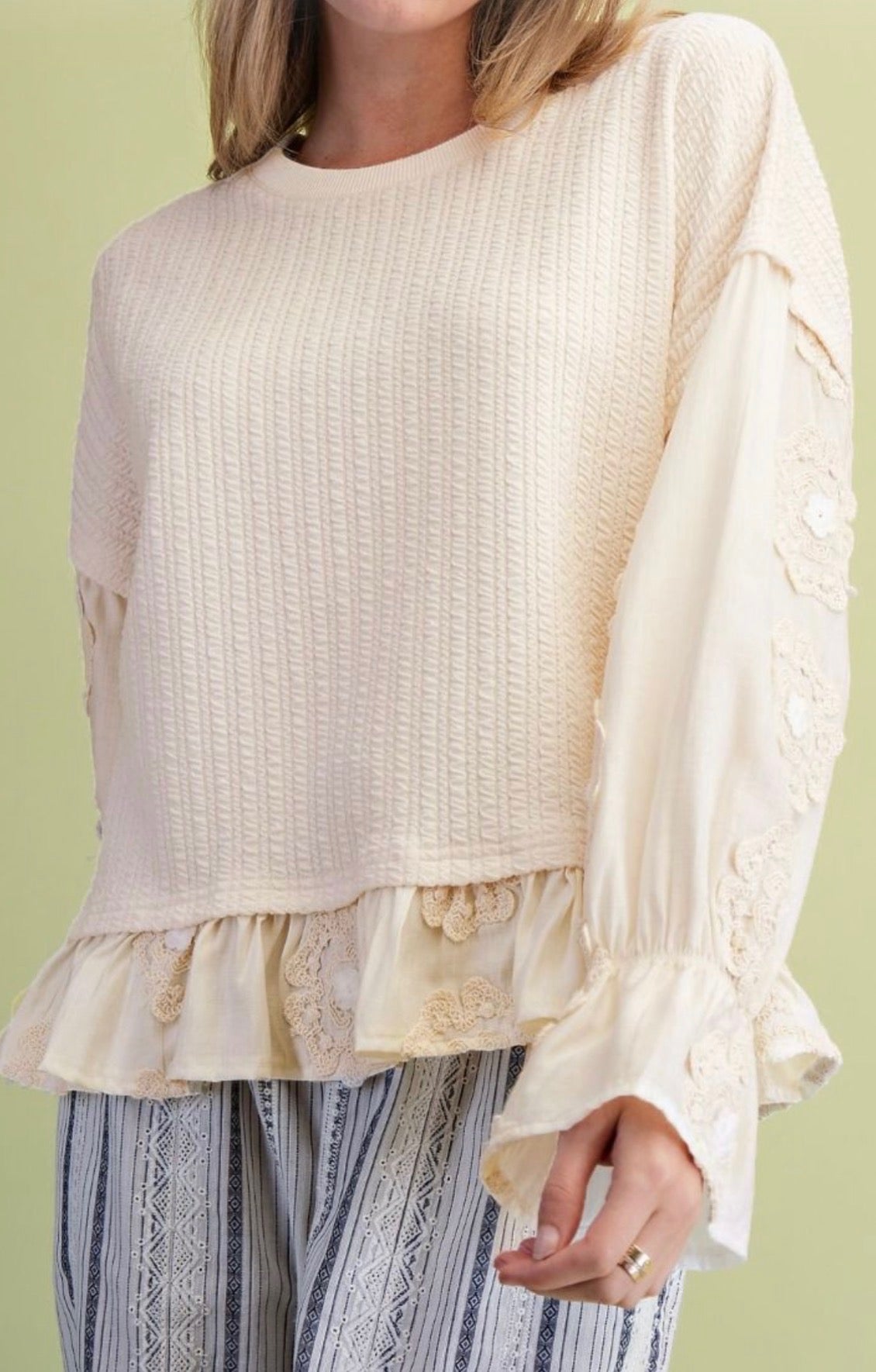 Ivory Ruffle Bottom Loose Fit Top