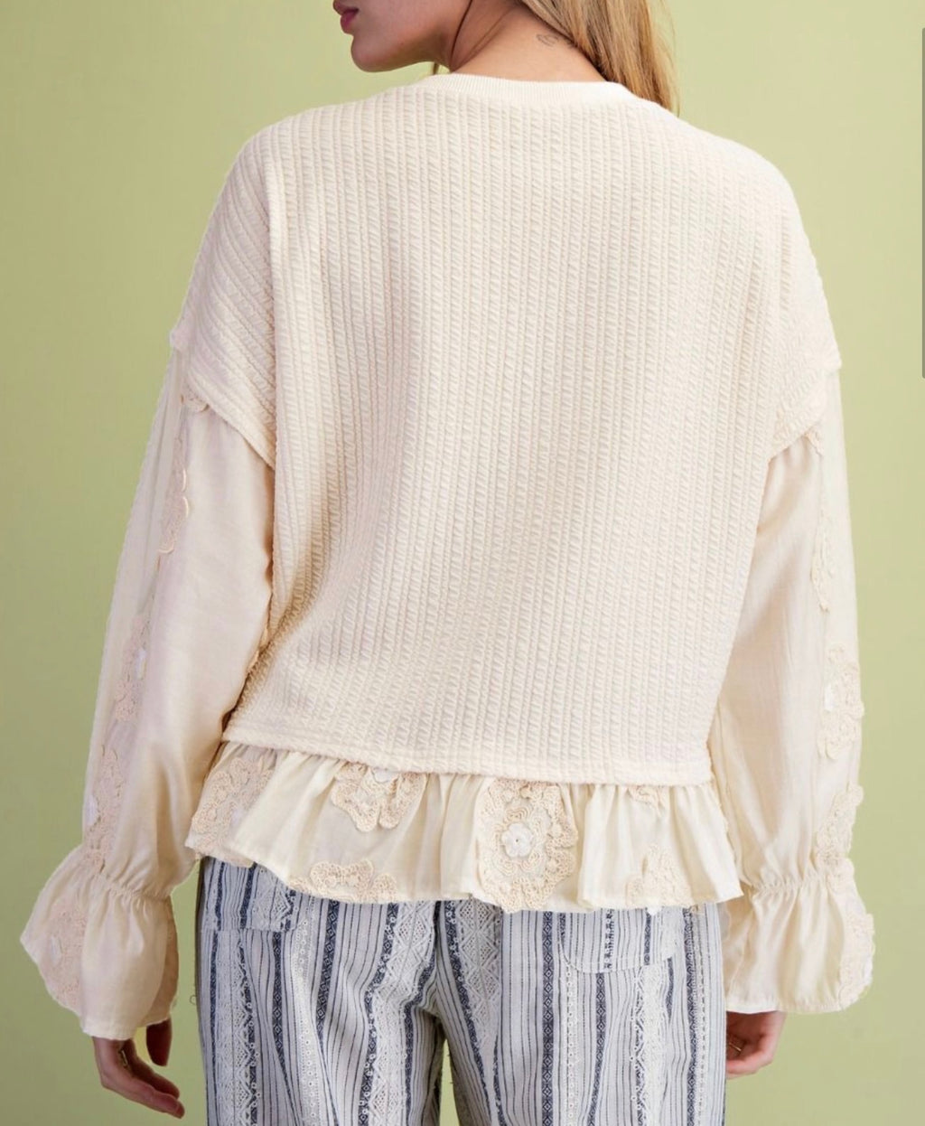 Ivory Ruffle Bottom Loose Fit Top