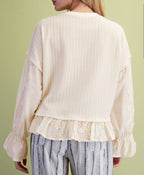 Ivory Ruffle Bottom Loose Fit Top