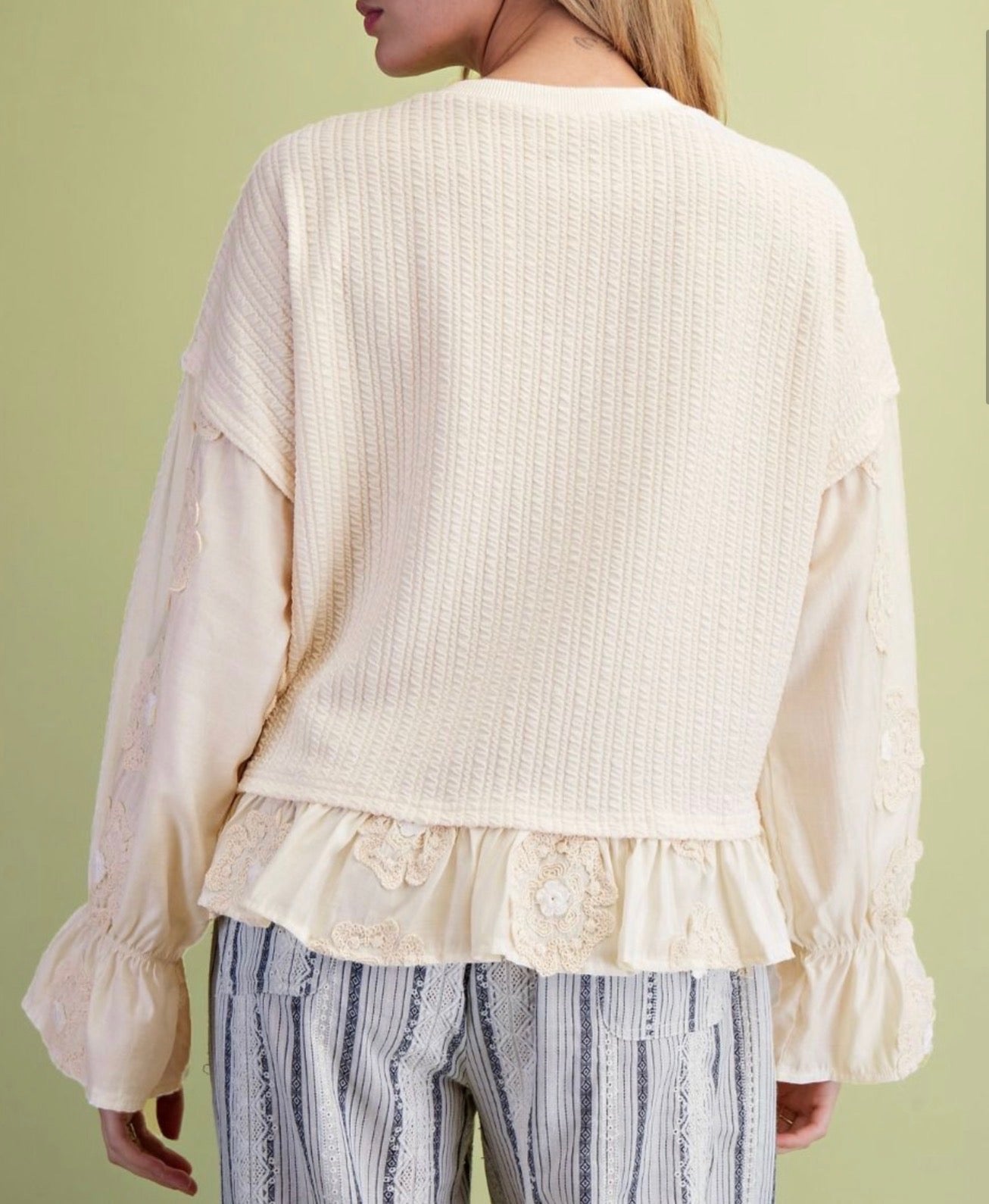 Ivory Ruffle Bottom Loose Fit Top